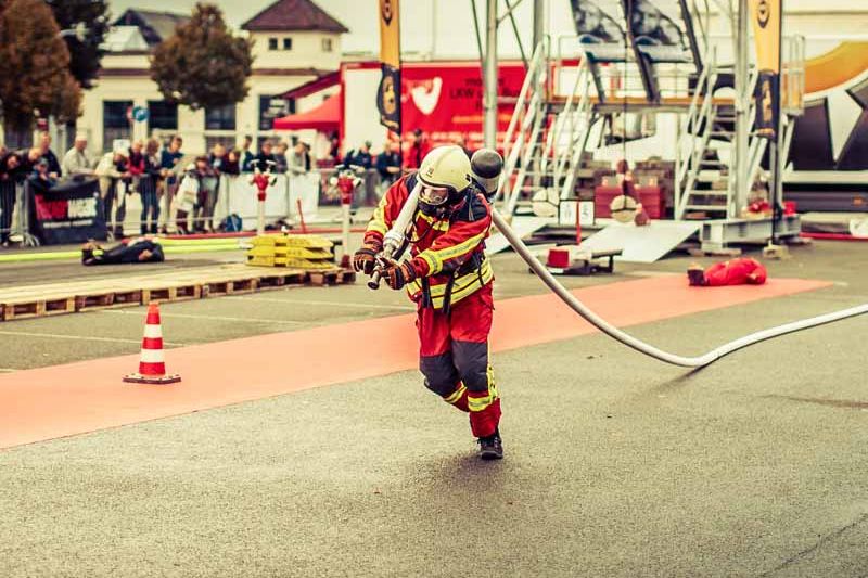 fire fighte dragging fire hose fire fighte dragging fire hose